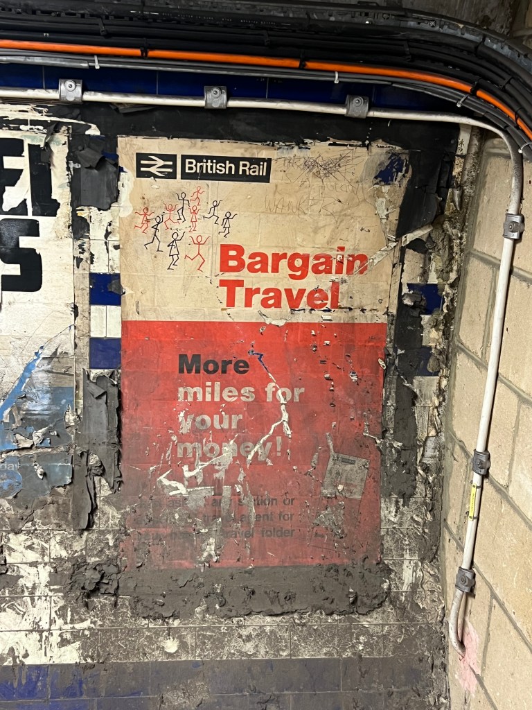 A red and white British Rail poster, the top half reads Bargain Travel and the bottom half is unreadable due to damage.