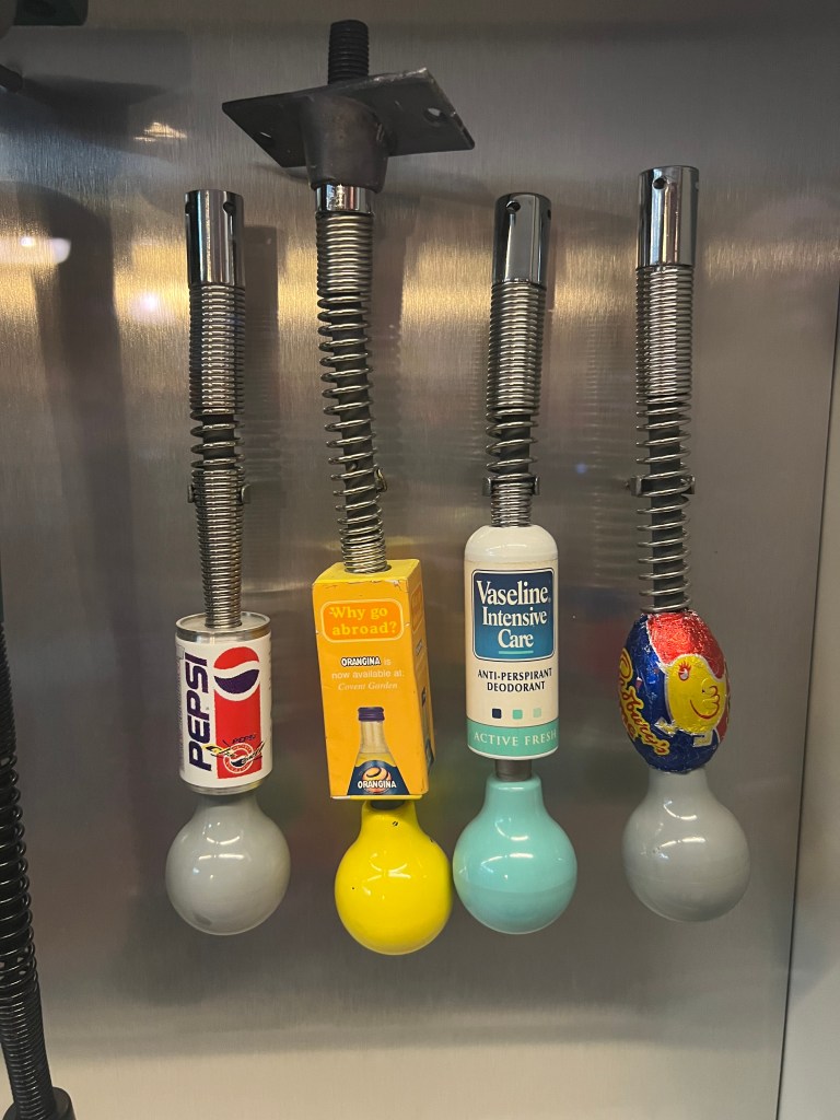 4 roof handles with advertising. Pepsi, Orangina, Vaseline deodorant and Cadbury's Creme Egg. 