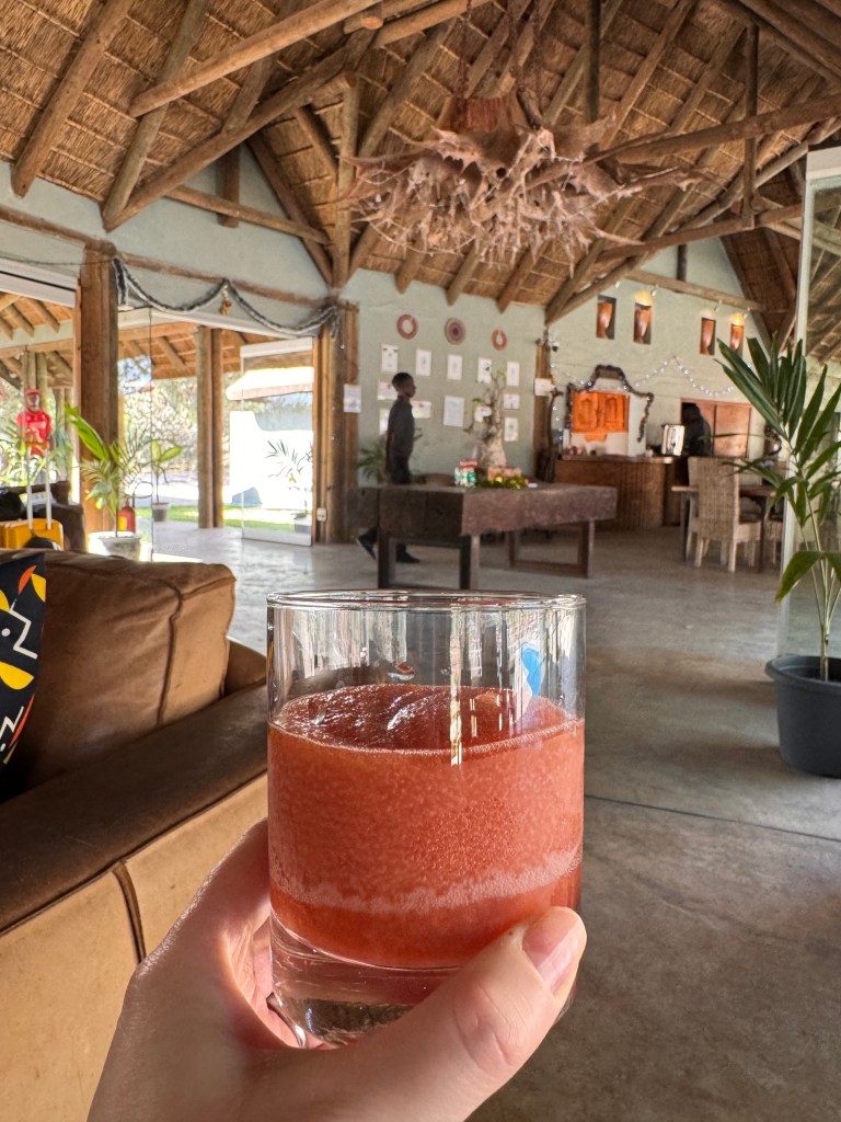 The Fathala welcome slushie. In the background is the reception of Fathala and the corner of a sofa. 
