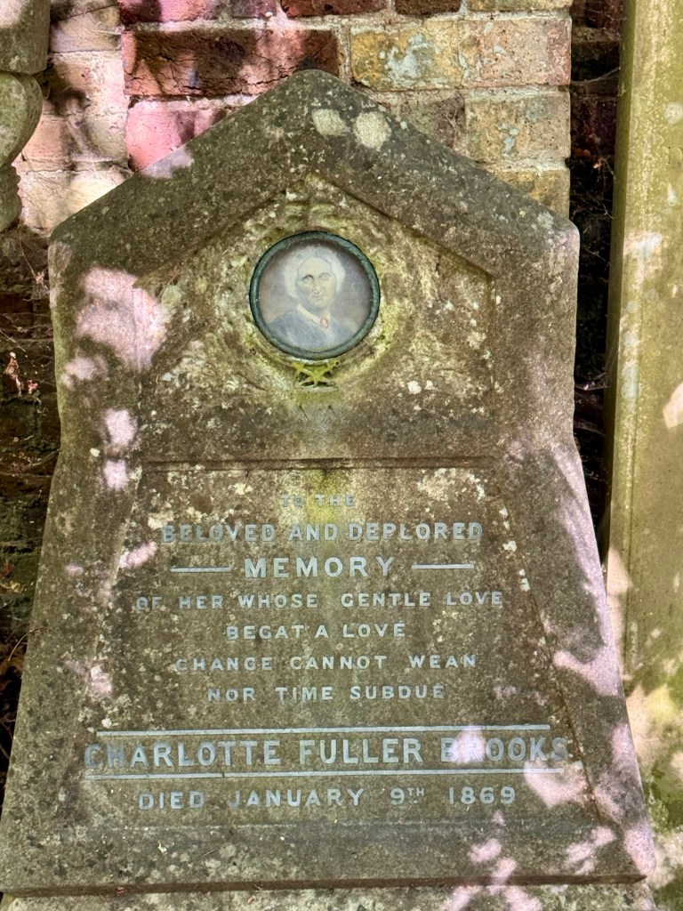 A Victorian gravestone with a photo set in to the stone. 